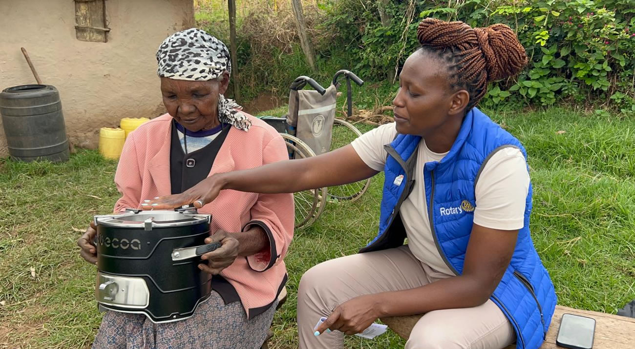 flowers on a mountainside overlooking a lake.
